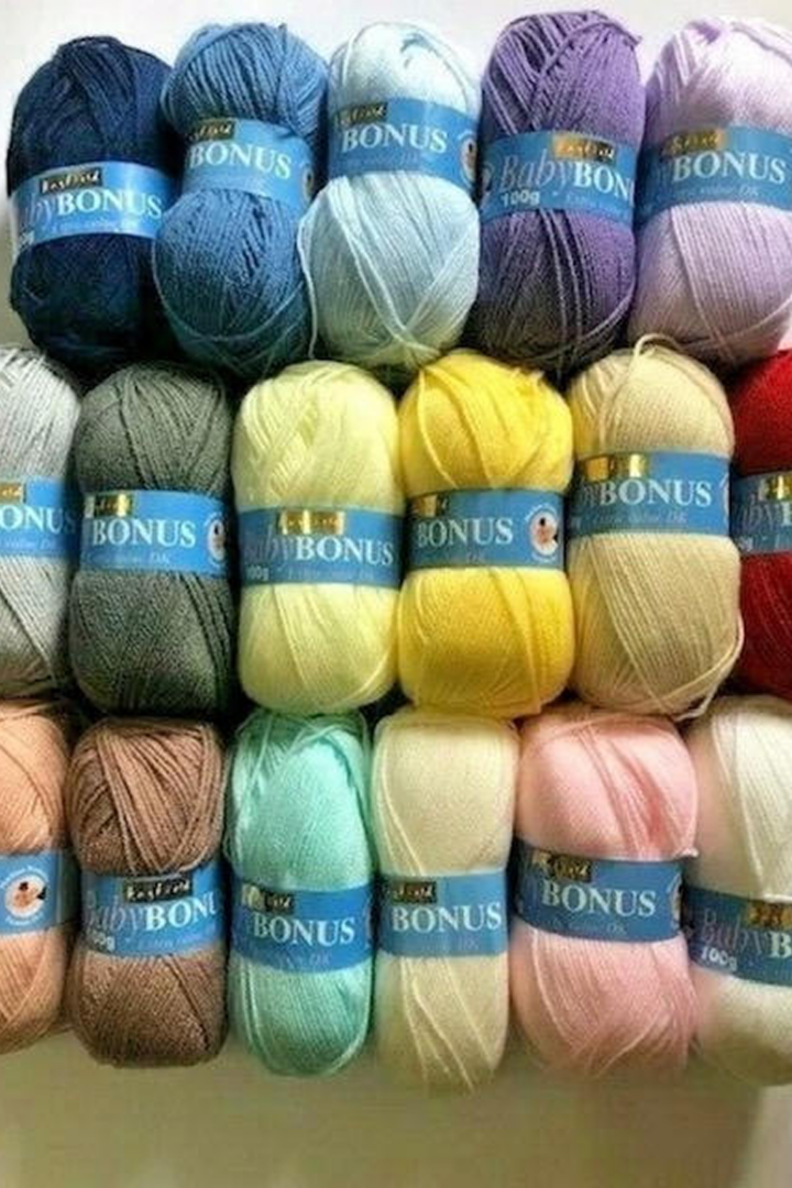 Colorful yarn skeins stacked in rows